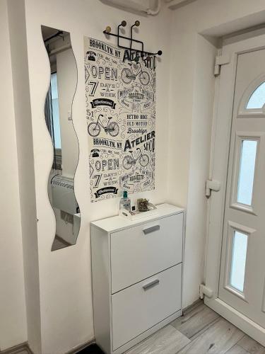 a room with a dresser and a mirror at Csillag Vendégház in Debrecen