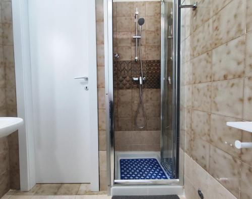 a shower with a glass door in a bathroom at luxury studio in Gallipoli