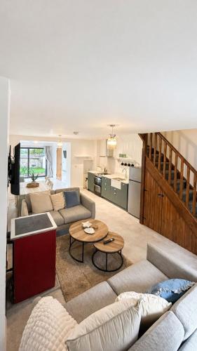 a living room with a couch and a table at Rose Cottage, Killala in Killala