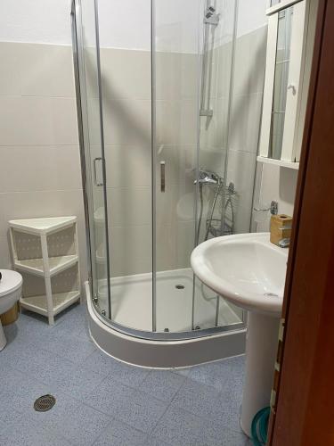 a bathroom with a shower and a sink at Olive Tree in Sarandë