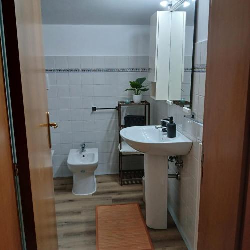 a bathroom with a sink and a toilet at Da Elio in Montacuto