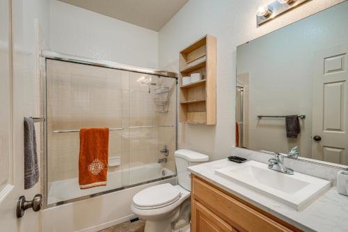 a bathroom with a sink and a toilet and a shower at Pool Table & Home Gym! Manteca Group Getaway in Manteca