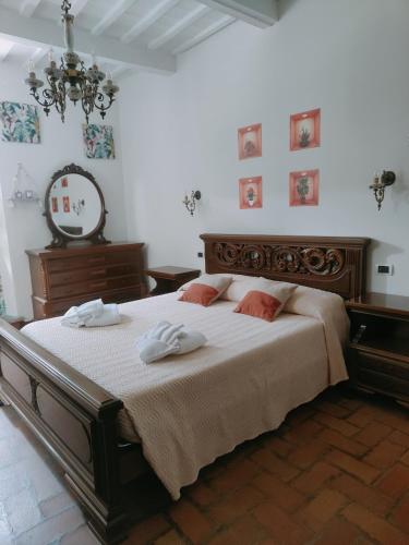 a bedroom with a bed with two towels on it at Dimora Frasassi - Genga in Genga