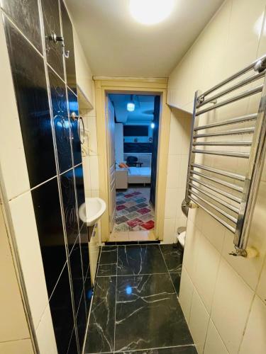 a bathroom with a shower and a sink at Taksim Pera Premium Gold Hotel in Istanbul