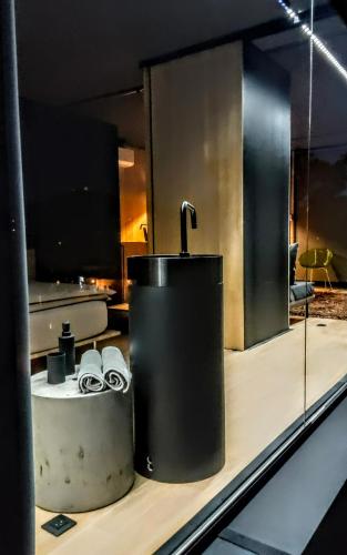 a bathroom with a faucet on a counter at Design apartmán in Teplice