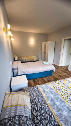 a room with two beds and two rugs at Crandford in Dublin