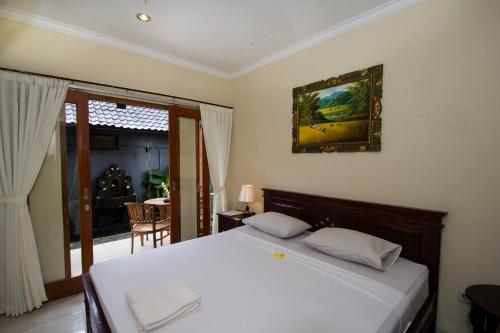 Postel nebo postele na pokoji v ubytování Baruna Guest House
