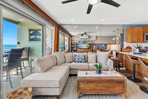 a living room with a couch and a table at Lahaina Roads 306 in Lahaina