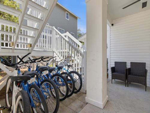 a row of bikes parked next to a house at Dune Our Thing in Blue Mountain Beach