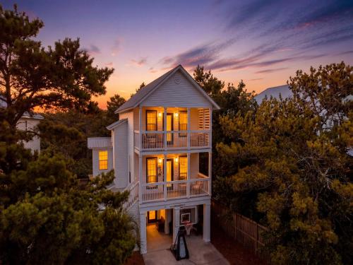 an aerial view of a house with its lights on at Dune Our Thing in Blue Mountain Beach