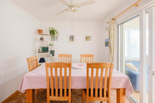 a dining room with a table and chairs at Beautiful 3 Bedroom House in Ennistymon