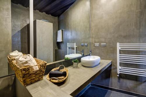 a bathroom with a sink and a mirror at Hoteles Pueblo de Tierra in San Pedro de Atacama