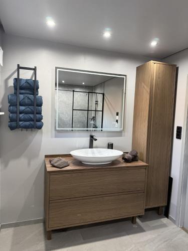 a bathroom with a sink and a mirror at Nordlys Skaland in Senja