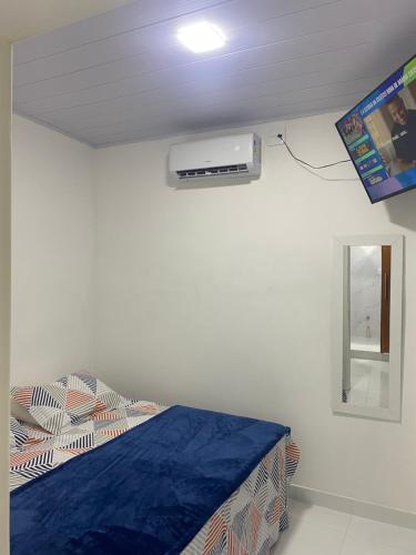 a hospital room with a bed and a window at APTO - Espaço Vix II in Vitória