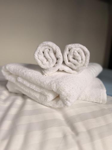 a stack of towels on top of a bed at Coopers Lane in Dublin