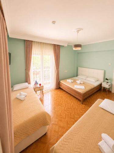 a room with two beds in a room at Amaya Pine Studio in Panagia
