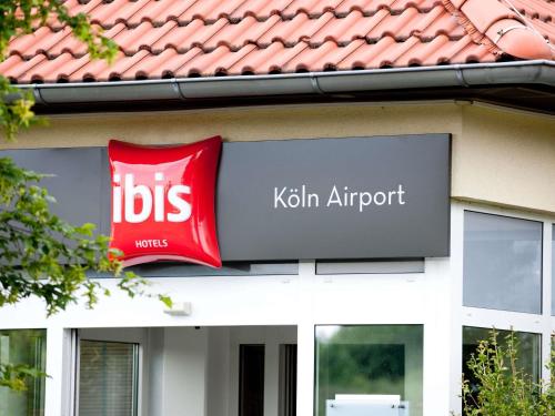 a sign on the side of a kittair airport at ibis Hotel Köln Airport in Cologne