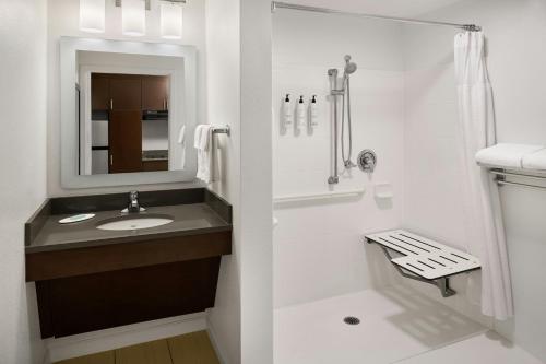 a bathroom with a sink and a shower at TownePlace Suites by Marriott Springfield in Springfield