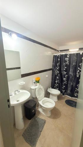 a bathroom with two toilets and a sink at Julieta in La Rioja