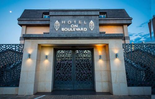 a building with a door with a hotel on ballard at Hotel on Boulevard in Johannesburg