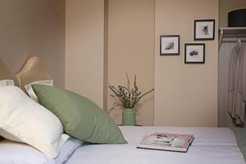 a book sitting on top of a bed at Dos del Sul in Roe