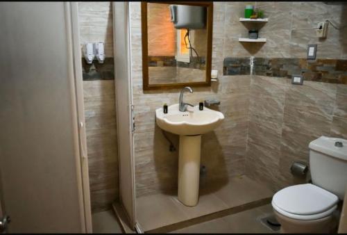 a bathroom with a sink and a toilet at Bianki vip villa in Alexandria