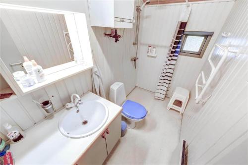 a small bathroom with a sink and a toilet at 30312-Odder-Lyngbakkevej-29 in Odder