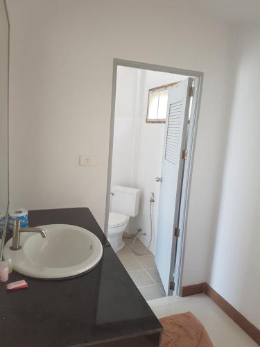 a bathroom with a sink and a toilet at Diamond Beach Resort in Ko Tao