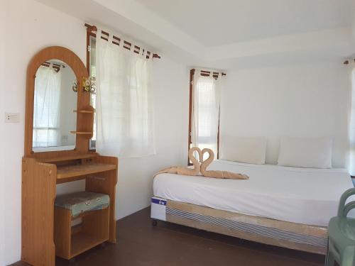 Ένα ή περισσότερα κρεβάτια σε δωμάτιο στο Diamond Beach Resort