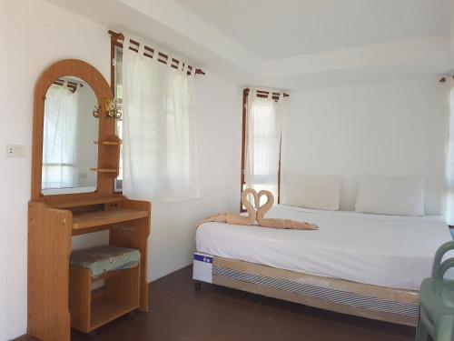 Postel nebo postele na pokoji v ubytování Diamond Beach Resort