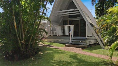 a small house with a porch and a porch at Picnic Bay Chalet Unit 2 in Picnic Bay