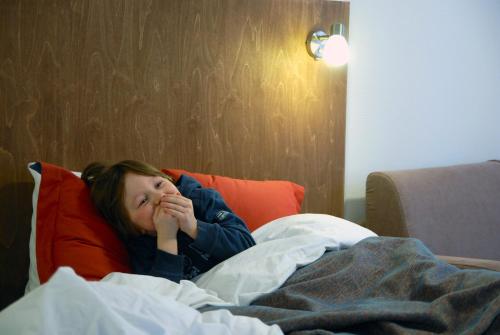 Postel nebo postele na pokoji v ubytování Oravi Apartments