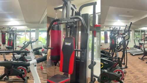 a gym with a bunch of exercise bikes at Dave Apartment in Pondoktjina Tiga