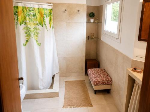 a bathroom with a shower and a toilet and a sink at Casa Verde in La Cumbre