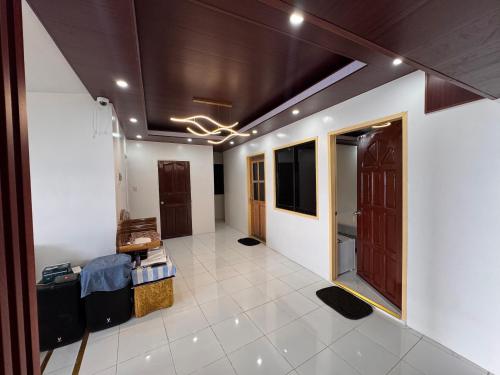 a large room with a hallway with a room with at Ellen Homestay in San Juan