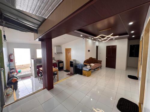 a living room with a couch and a table at Ellen Homestay in San Juan