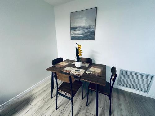 a dining room table and chairs in a room at Beautiful Brand-New studio in New Port Richey