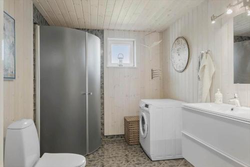 a white bathroom with a toilet and a sink at OH451-Hadsund-Haslevgaarde-Bakker-72 in Hadsund