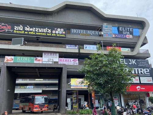 a building with a lot of signs on it at Hotel Aqua in Rajkot