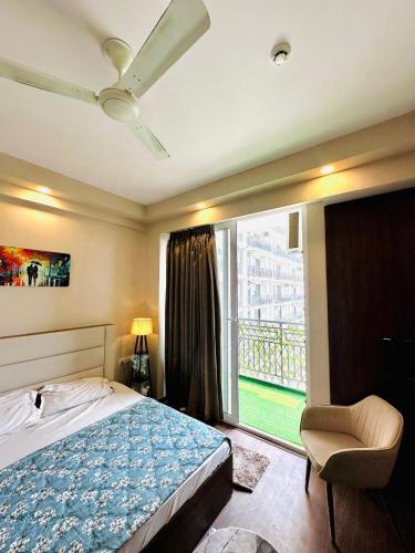 a bedroom with a bed and a large window at D Haven Stays in Greater Noida