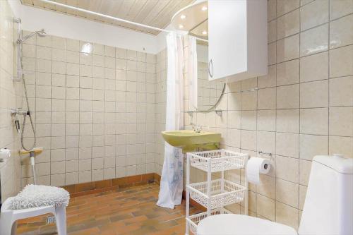 a bathroom with a toilet and a sink at 9116-Gudhjem-Rovej-22 in Gudhjem