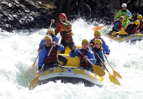 a group of people on a raft in the water at Hotel Florido in Sort