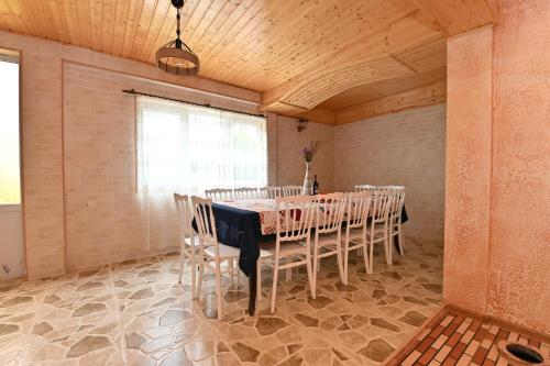 a dining room with a table and chairs at Hilltop Jikha in Jikhaskari