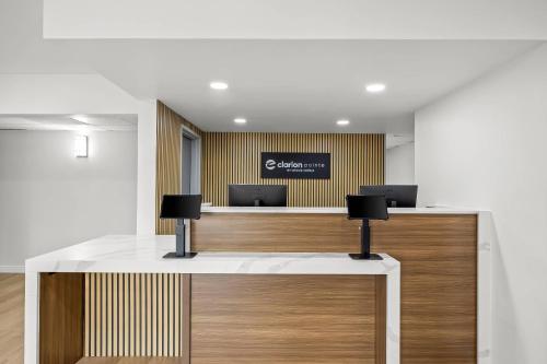 an office with a reception desk with two desks at Clarion Pointe Springfield Southeast in Springfield