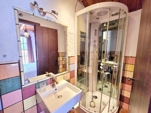 a bathroom with a sink and a glass shower at jade in Ubrique