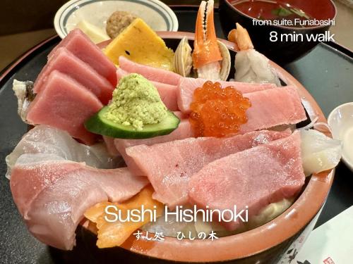 a bowl filled with different types of food on a table at suite Funabashi SAKURA2 #202 in Funabashi