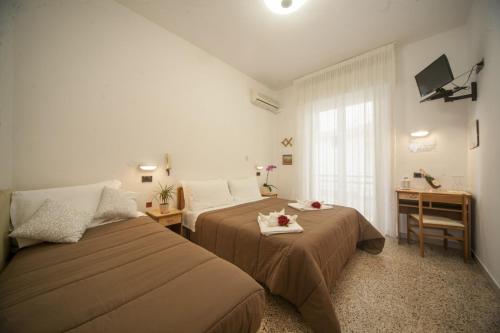 Postel nebo postele na pokoji v ubytování Hotel Zurigo