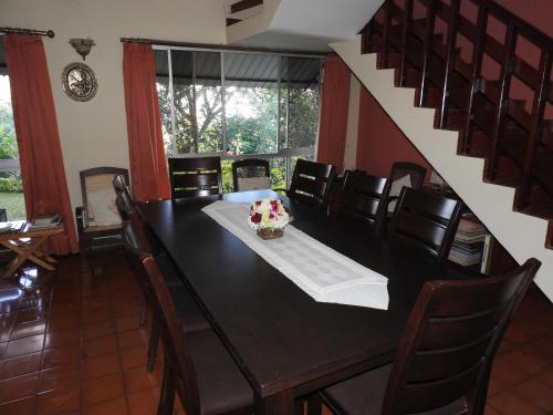 a dining room with a table and chairs at Hanthana Breeze Home Stay in Kandy