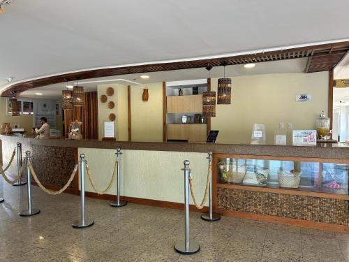 a food counter in a restaurant with a counter at Gran Lençóis Flat Residence - Flat 302 in Barreirinhas