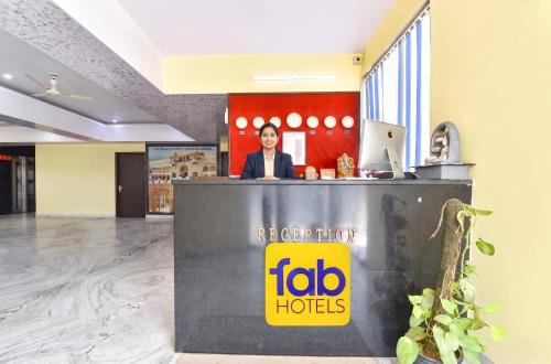 a reception desk in a lobby with aida hotels sign at FabHotel Kirara - Nr Jaipur International Airport in Jaipur